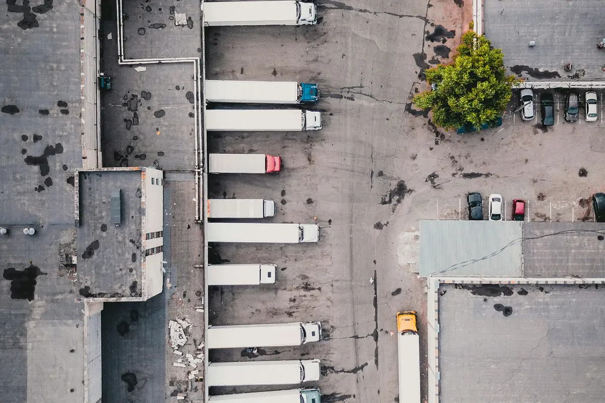 Aerial view of trailers backed into loading docks at a freight terminal